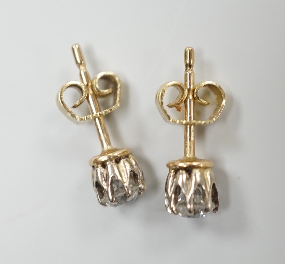 A pair of 585 yellow metal and solitaire diamond set ear studs, each stone weighing approx. 0.15-0.20ct, gross weight 1.7 grams.